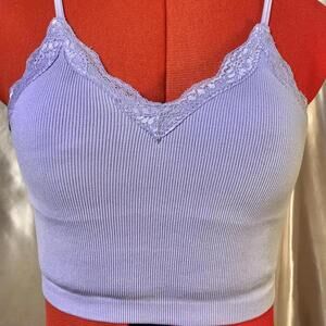 Purple lace bralette crop top with adjustable straps.
